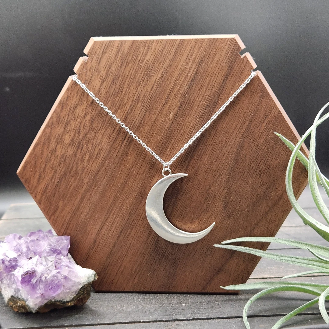 Lunar Elegance: Styling Your Moon Pendant in Times of Darkness